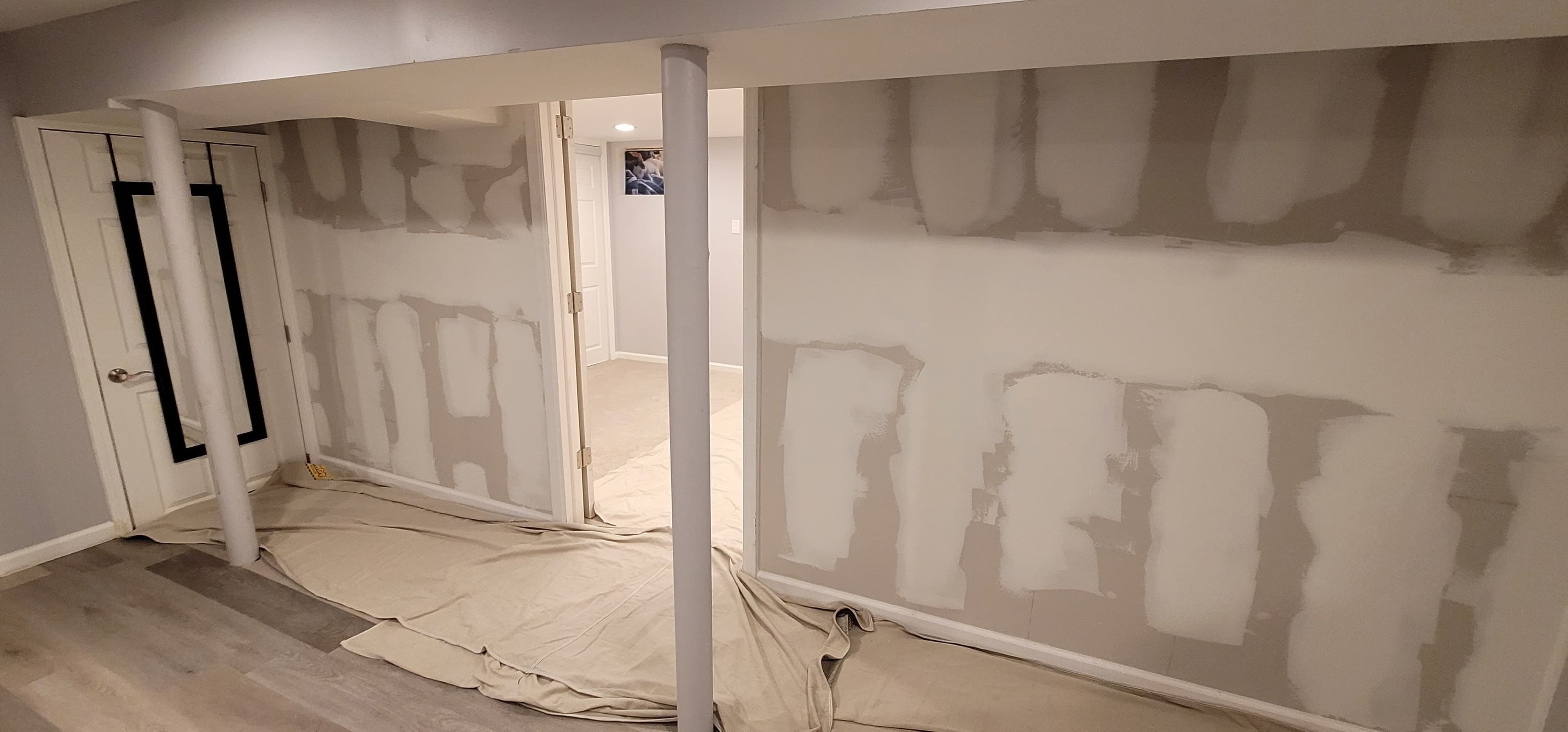 Basement finishing in progress — drywall taping, mudding, and LVP flooring installation, Rockland County NY