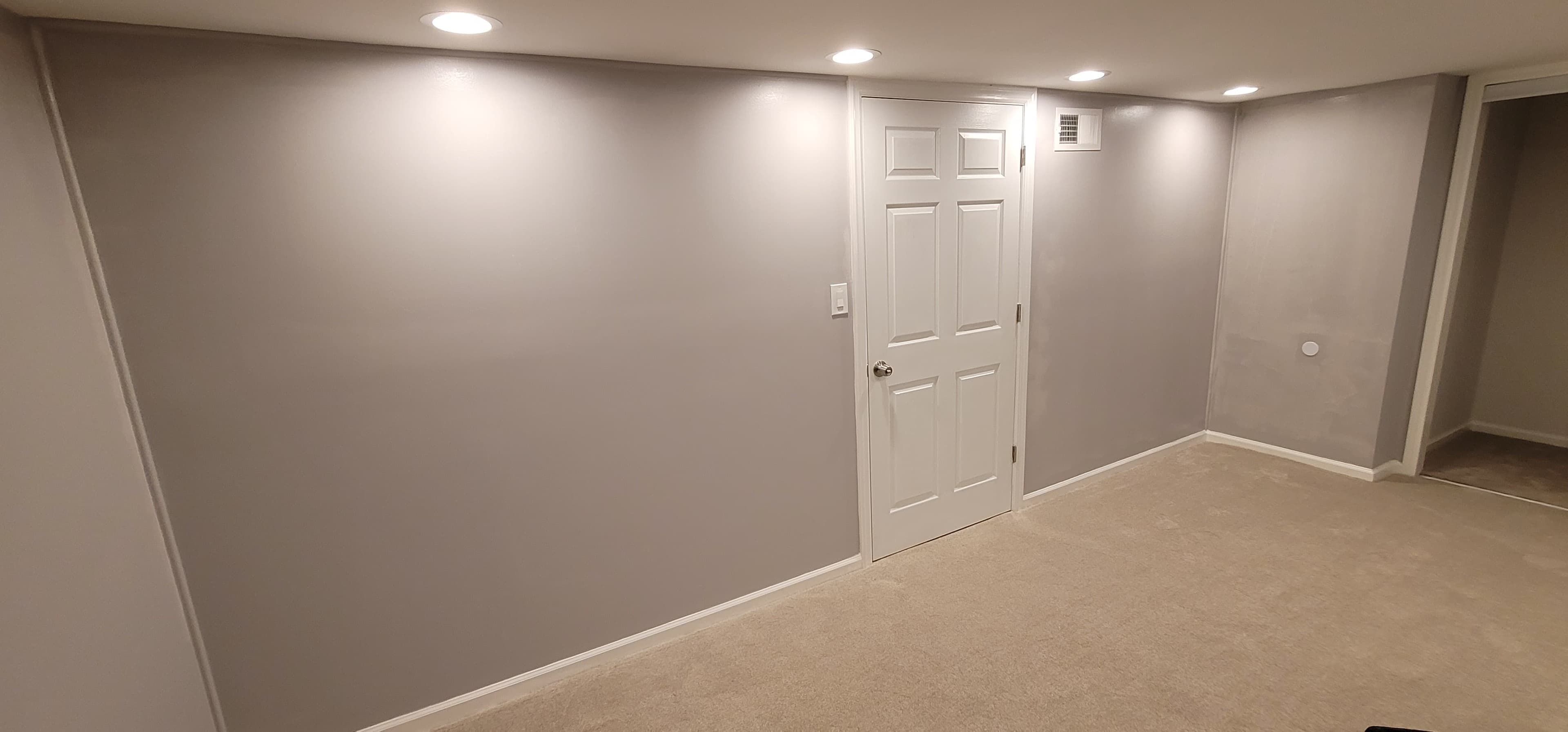 Finished basement room with gray walls, carpet, and recessed lighting, Rockland County NY