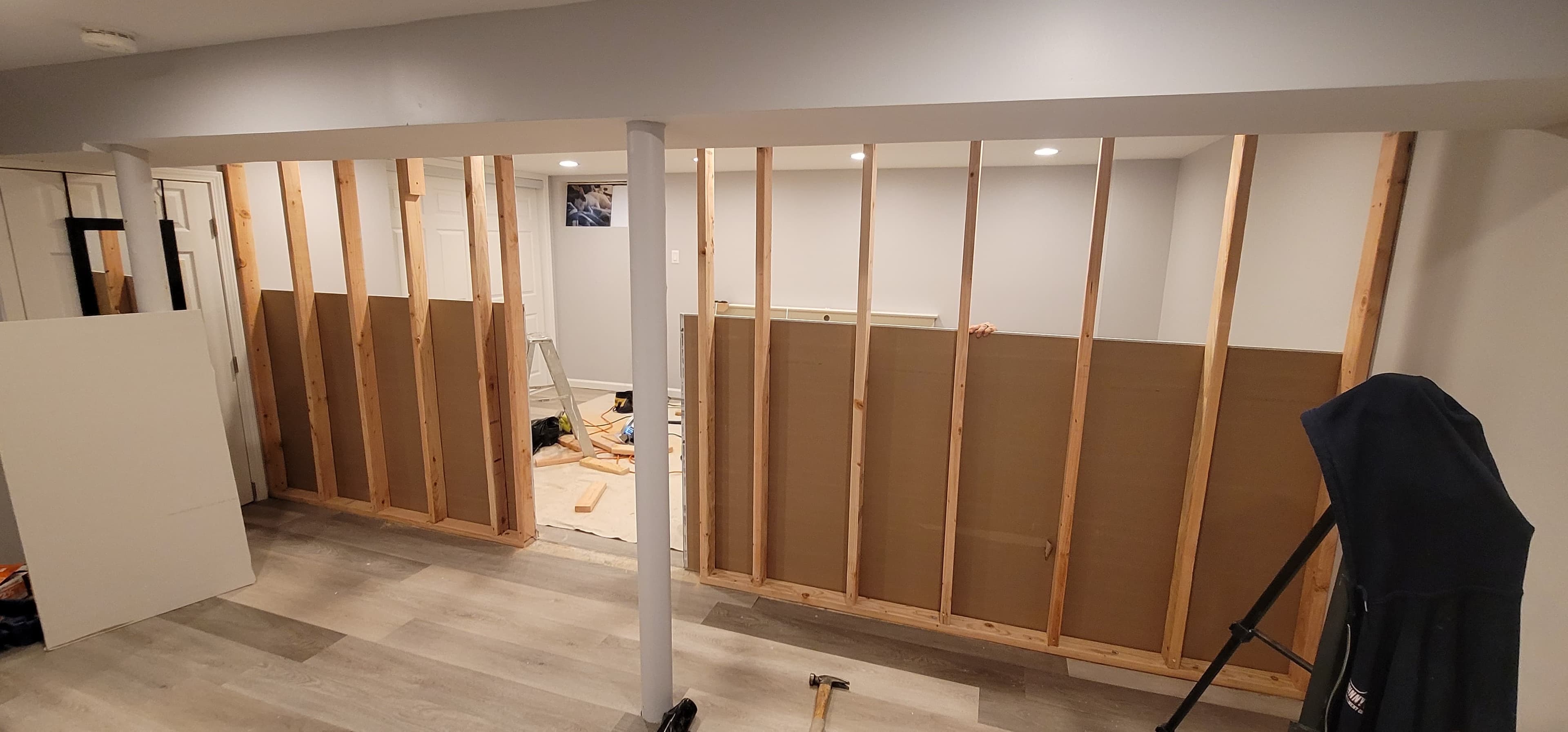 Basement finishing in progress — stud wall framing and wrapped column installation, Rockland County NY