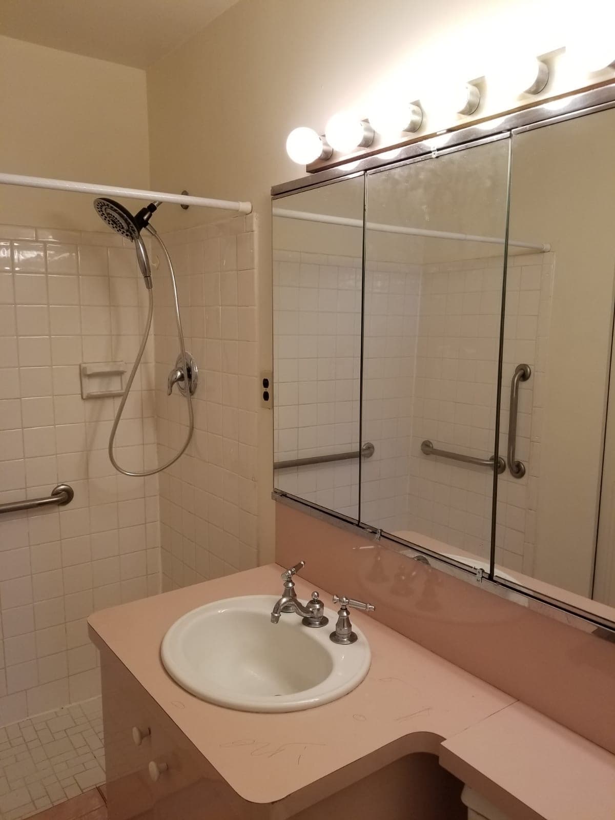 Before bathroom renovation — dated pink vanity and tub, Rockland County NY