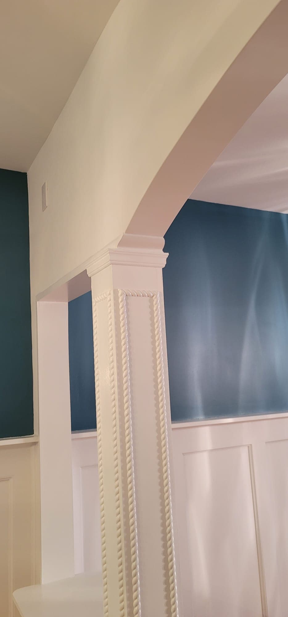 Interior painting — column and wainscoting panel transition with teal accent wall, Rockland County NY