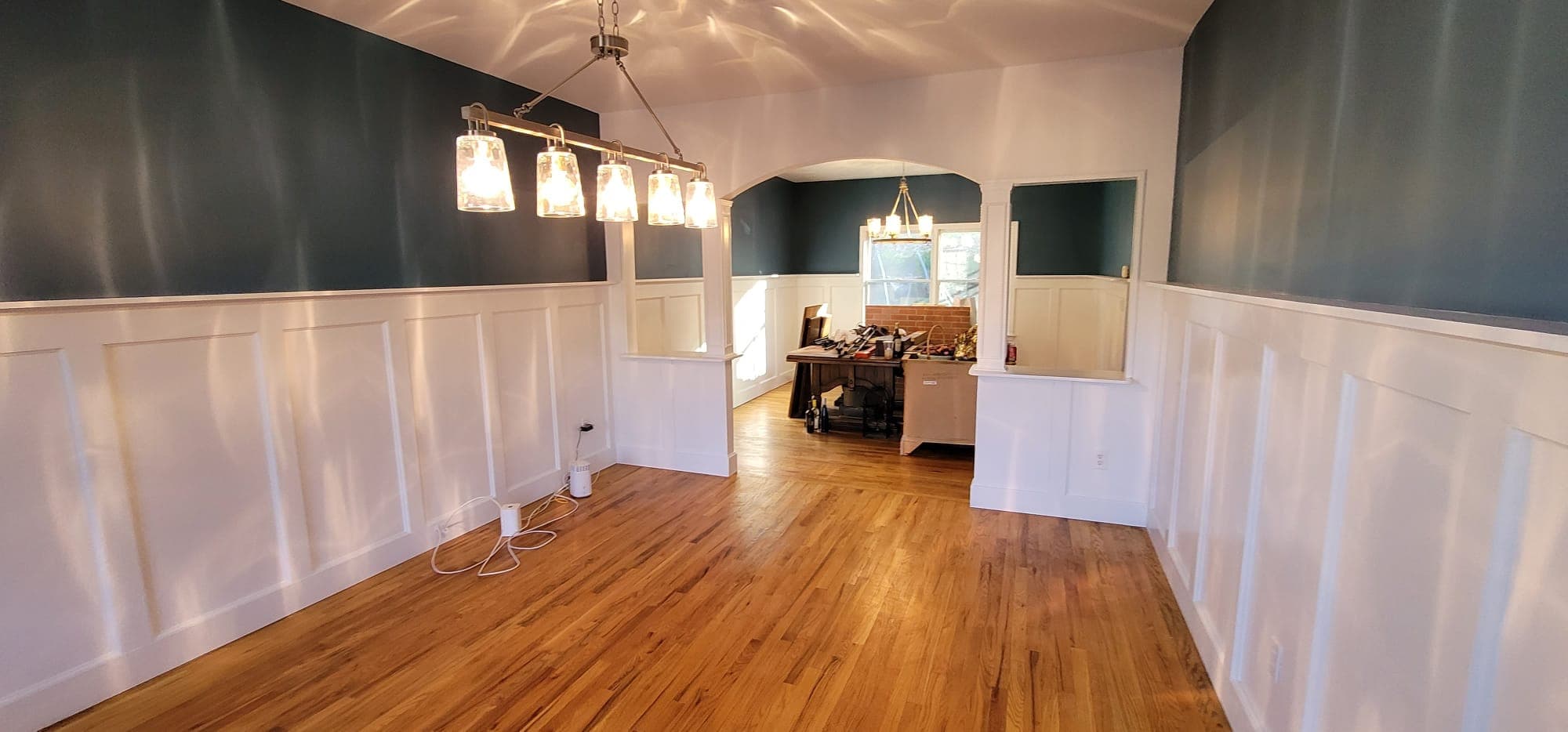 Interior remodeling — decorative columns, wainscoting, and pendant lighting in dining room, Rockland County NY by Q's Home Improvement