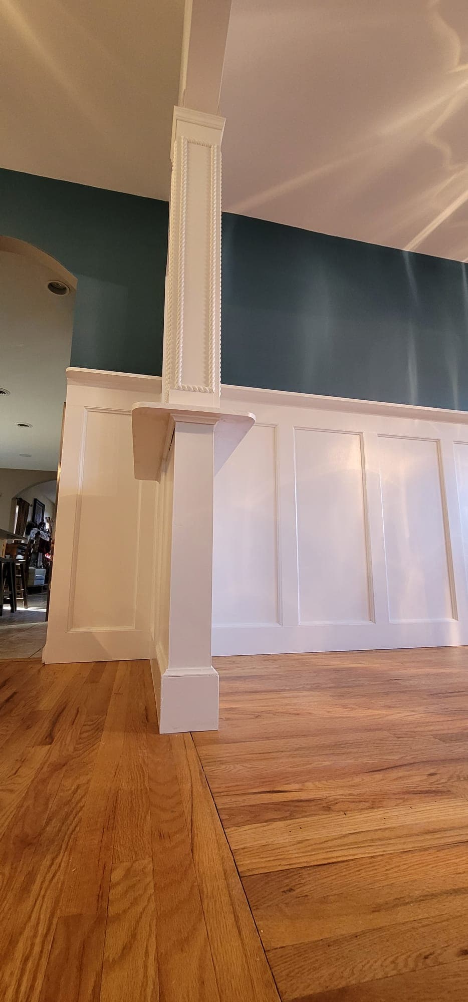 Interior painting and finish carpentry — column and wainscoting wall with white trim, Rockland County NY