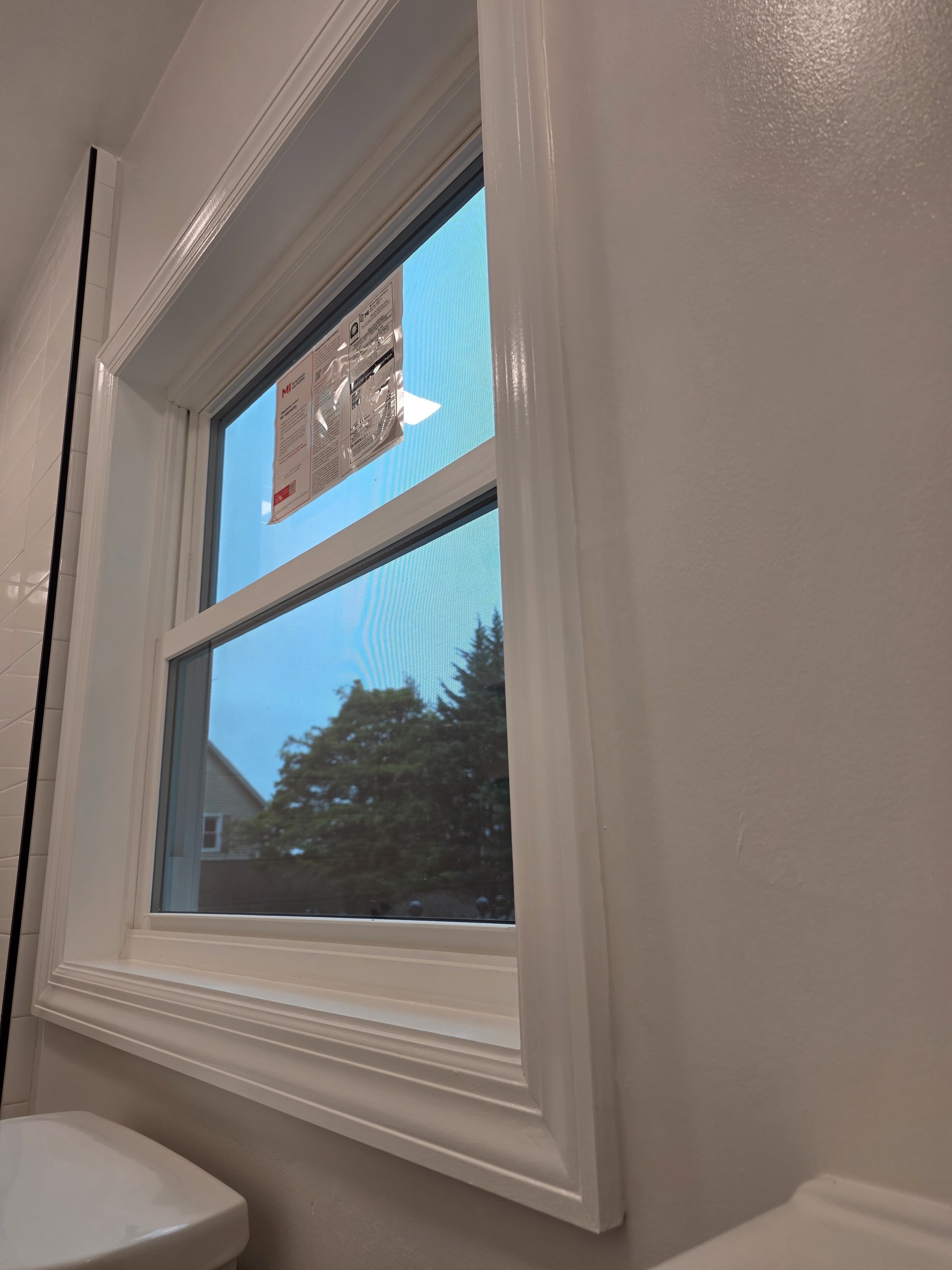 New MI Windows double-hung window installed in bathroom with tile surround, Rockland County NY